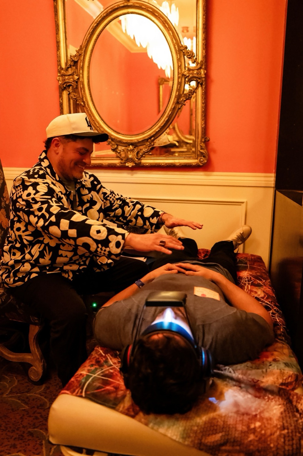 Gabriel holding space in a private session room